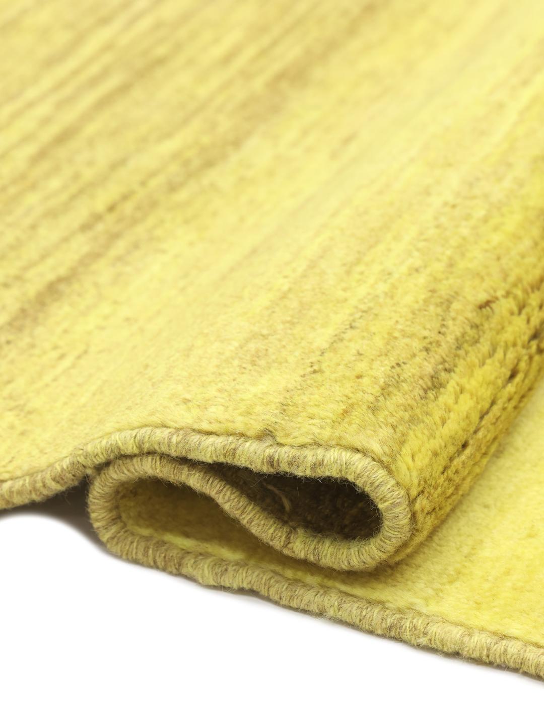 Hand-knotted yellow Gabbeh rug from the Middle East with a soft wool pile