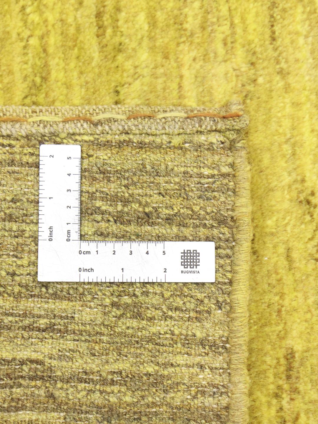 Hand-knotted yellow Gabbeh rug from the Middle East with a soft wool pile