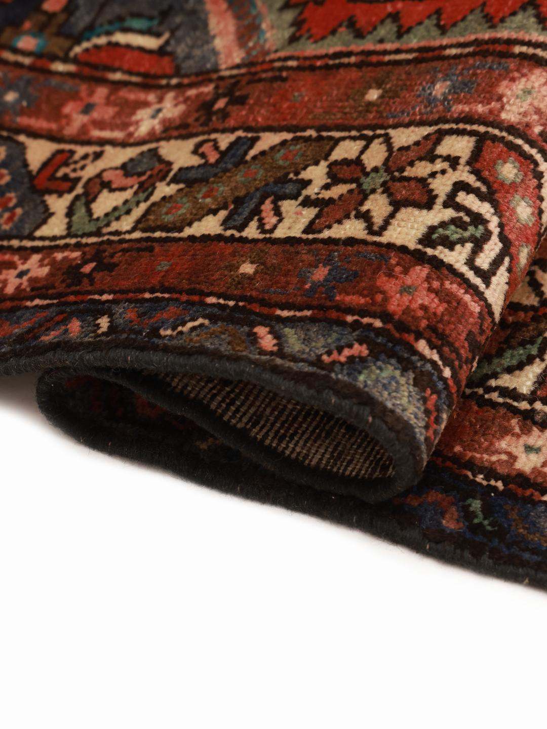 Hand-knotted Hamadan rug from the Middle East in dark-red