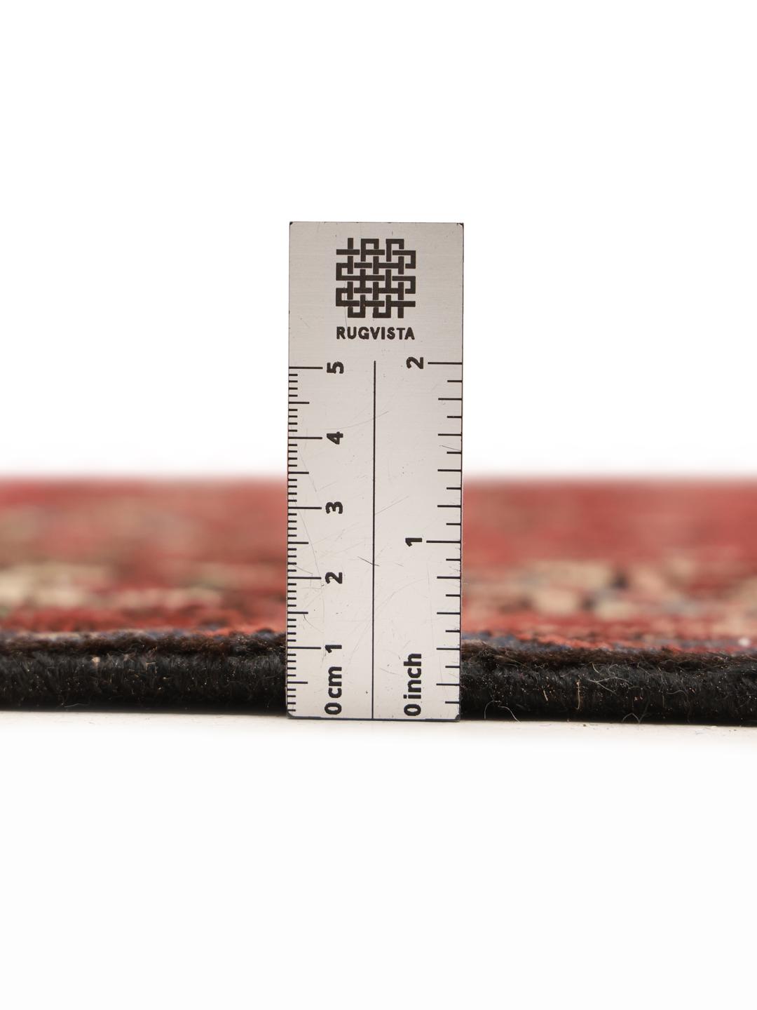 Hand-knotted Hamadan rug from the Middle East in dark-red