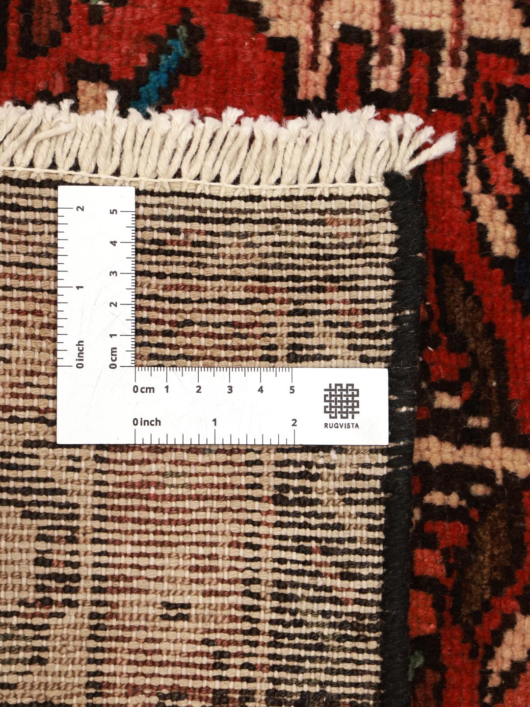 Hand-knotted Hamadan rug from the Middle East in dark-red