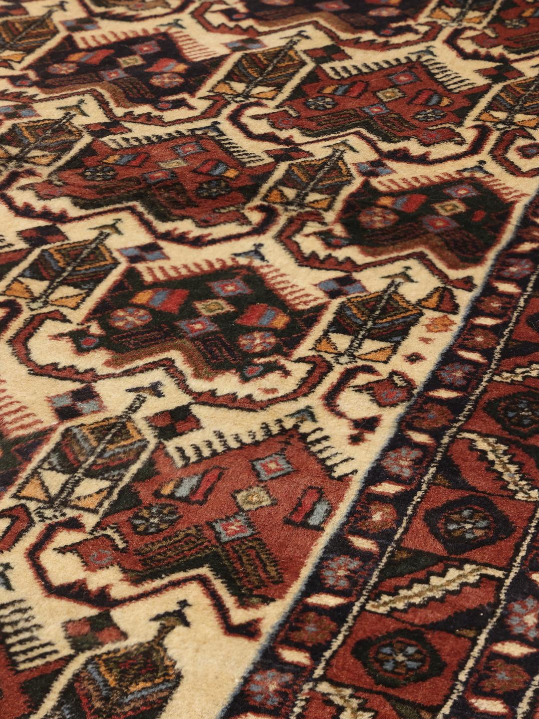 Hand-knotted Afshar Shahre Babak rug from the Middle East in shades of red and beige