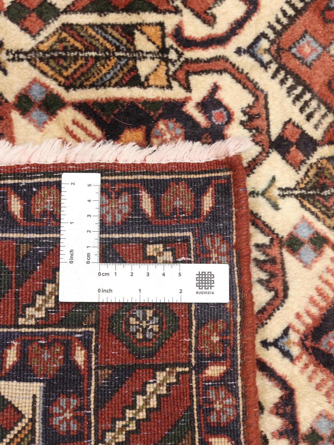 Hand-knotted Afshar Shahre Babak rug from the Middle East in shades of red and beige