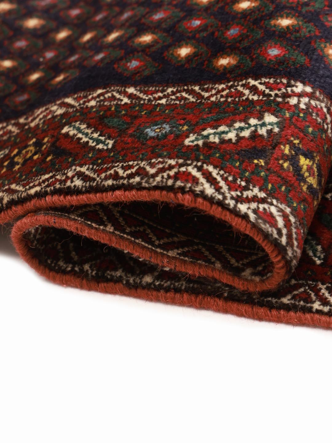 Hand-knotted Afshar Shahre Babak rug from the Middle East featuring a dark-red and black geometric pattern.