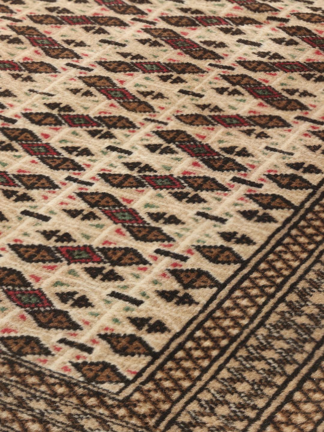 Håndknyttet Turkaman uldtæppe fra Mellemøsten i brune og beige nuancer.