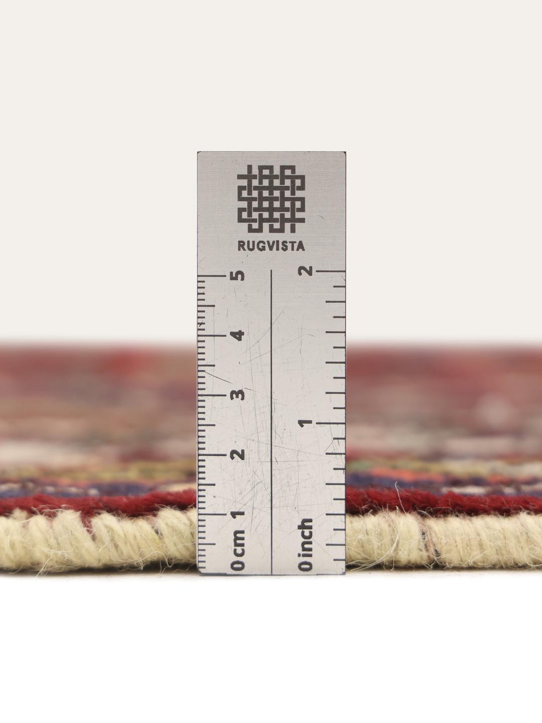 Hand-knotted Hosseinabad rug from the Middle East in deep red and blue tones