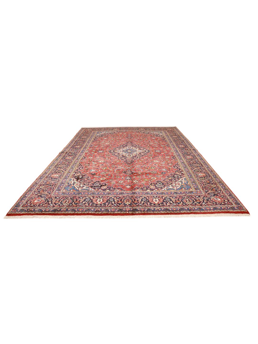 Hand-knotted Keshan rug from the Middle East in red and deep blue tones.