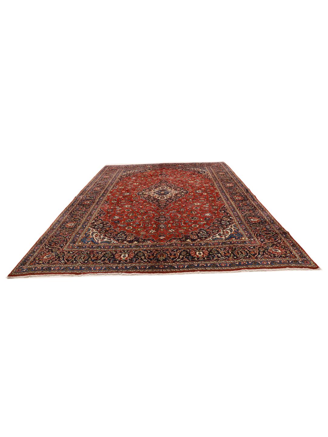 Hand-knotted Keshan rug from the Middle East in red and deep blue tones.