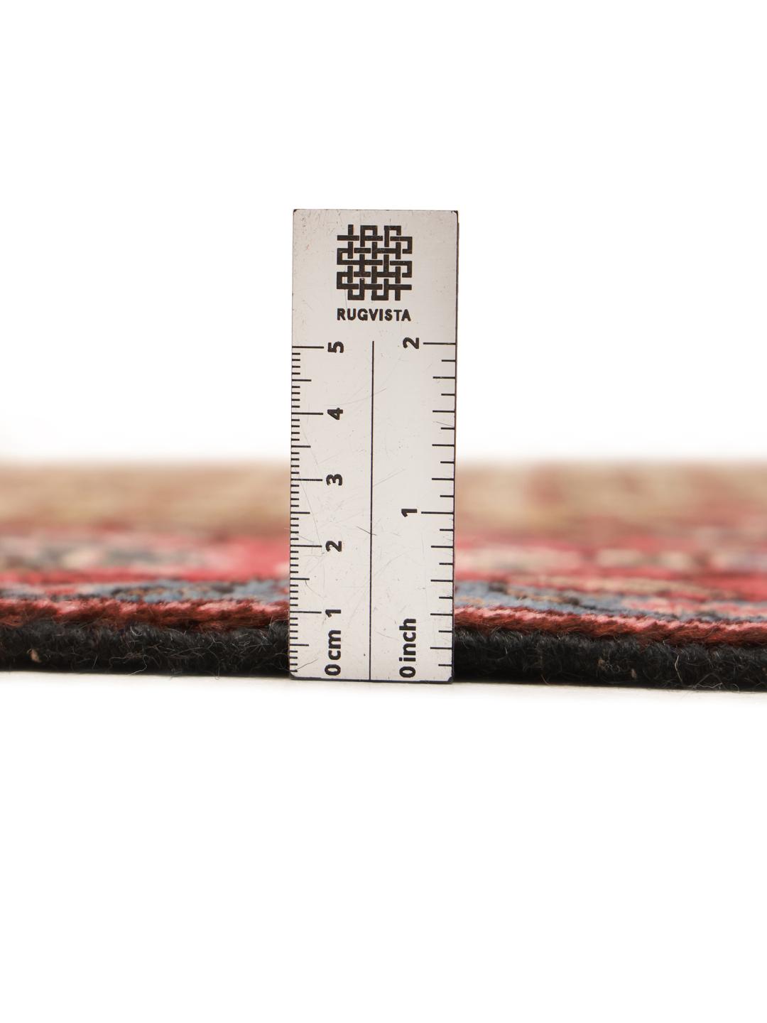 A unique hand-knotted Koliai rug from the Middle East in brown and red tones.