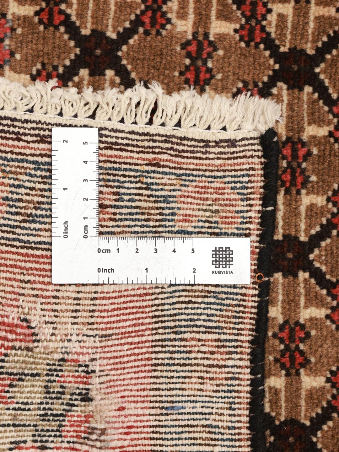 A unique hand-knotted Koliai rug from the Middle East in brown and red tones.