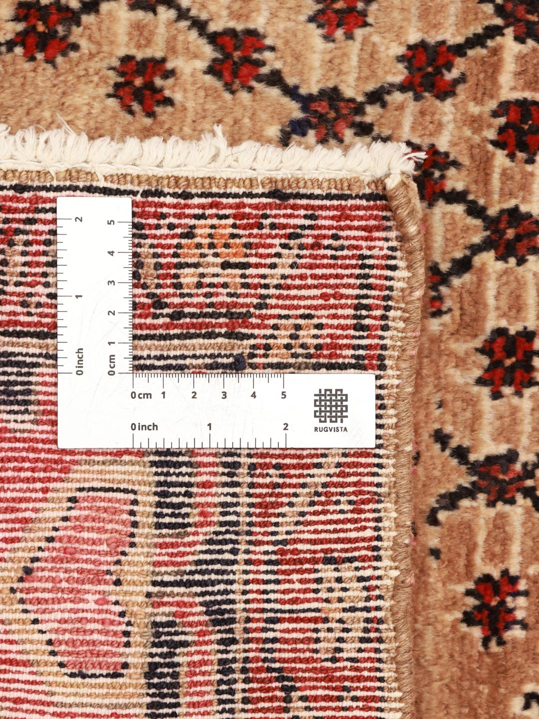 A hand-knotted Koliai rug from the Middle East with a multicolor geometric design.