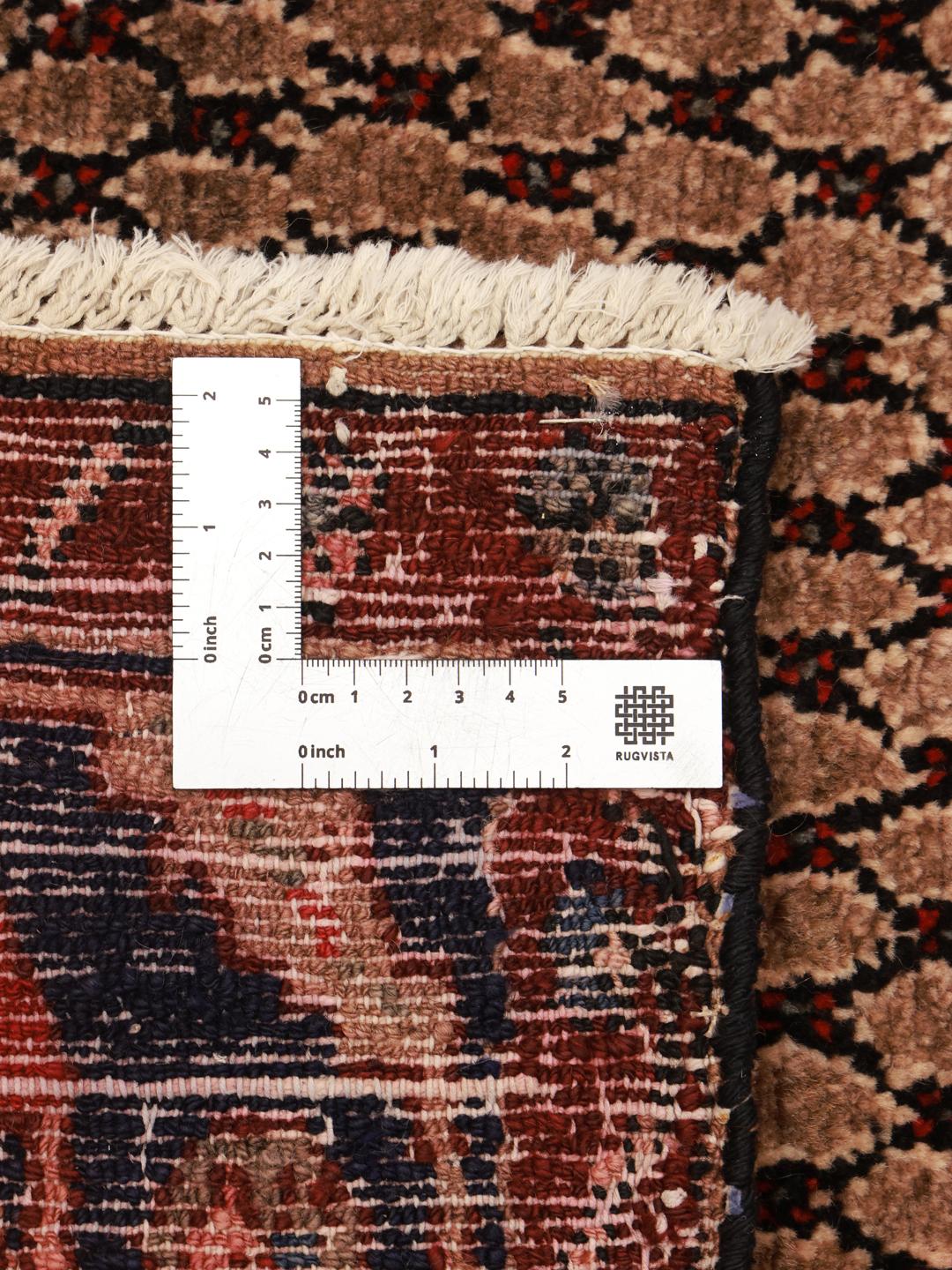 Hand-knotted Middle Eastern Koliai rug in shades of brown and red