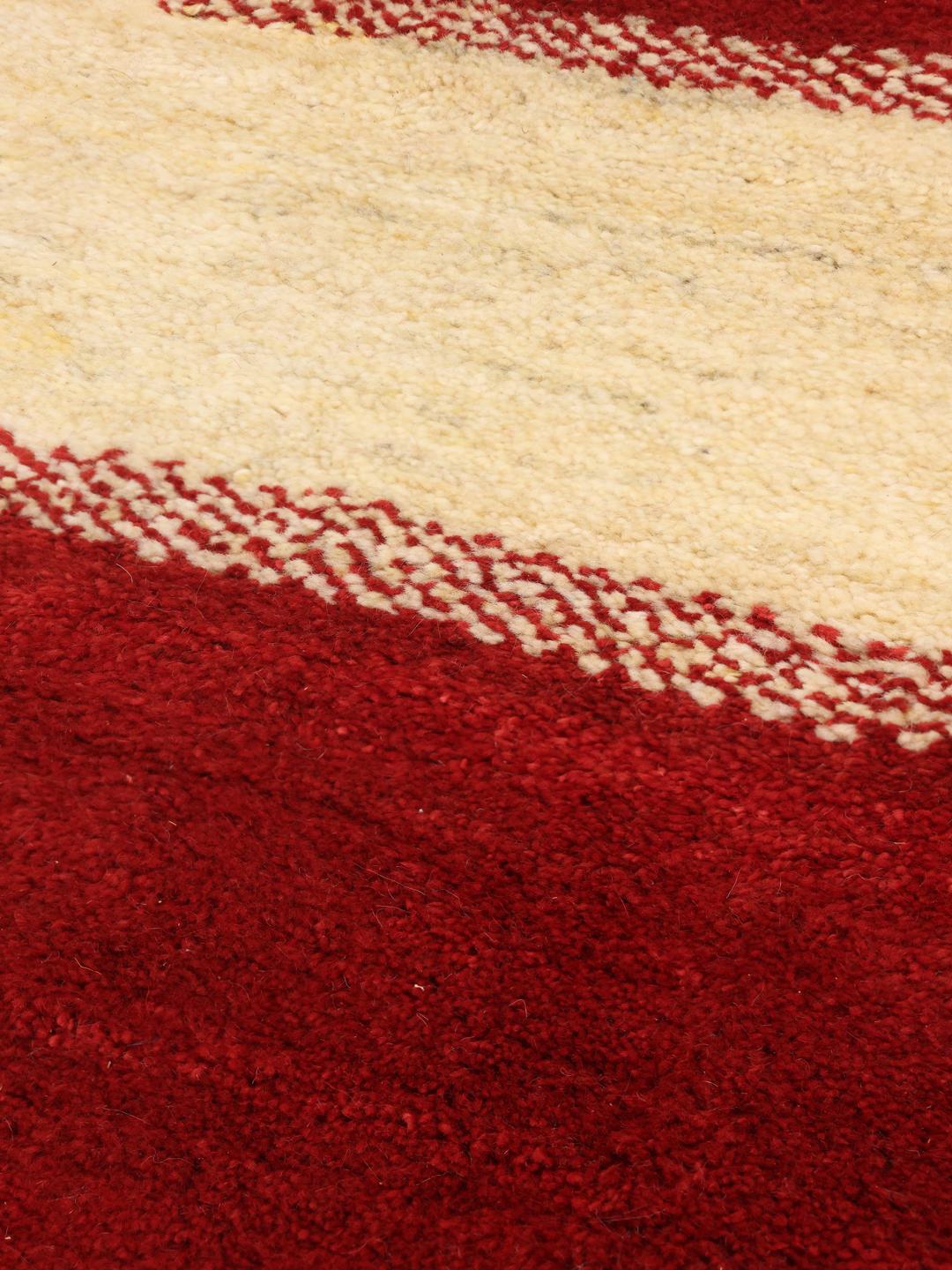 Hand-knotted Gabbeh Fine rug from the Middle East in red and beige tones