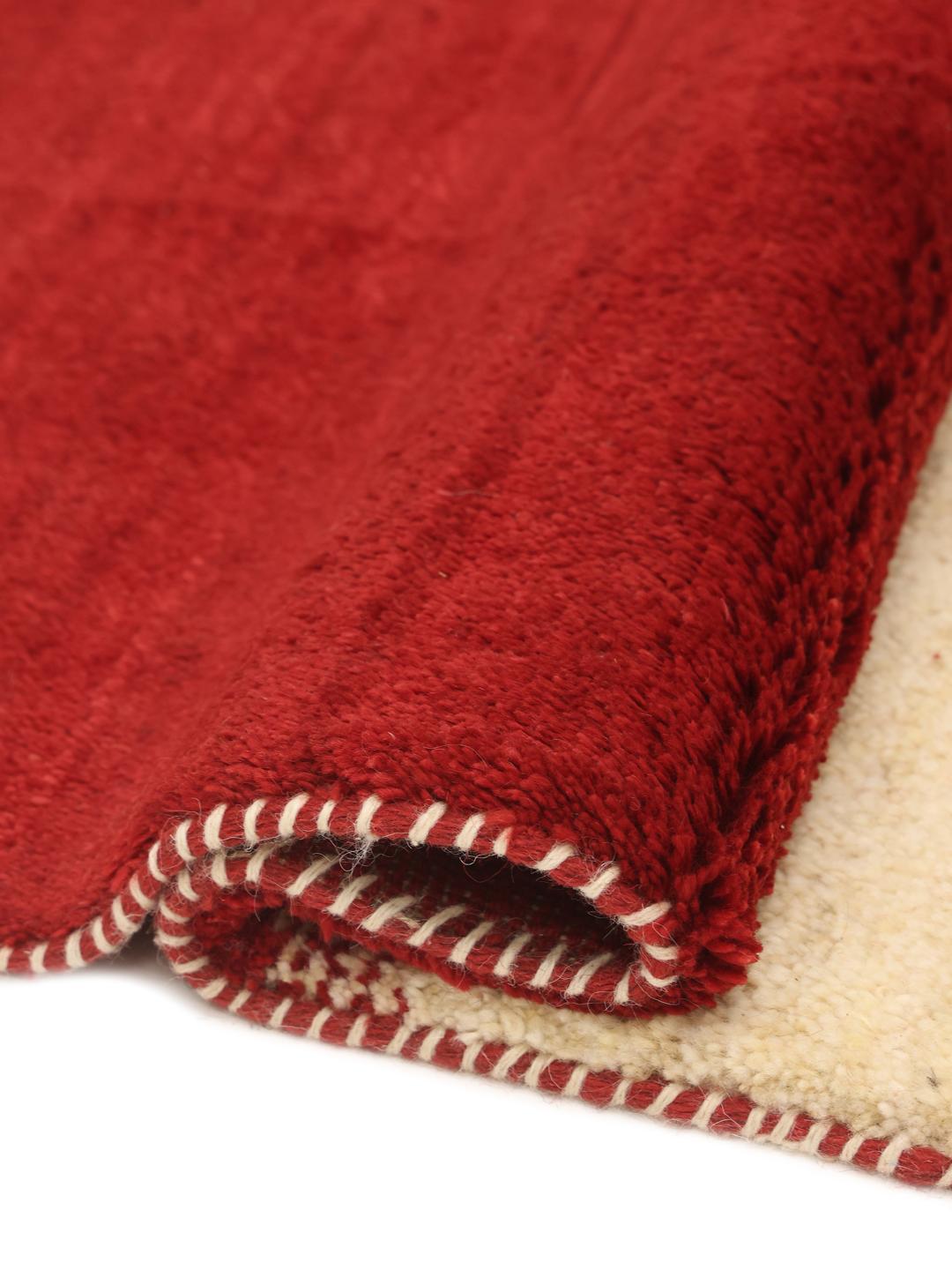 Hand-knotted Gabbeh Fine rug from the Middle East in red and beige tones