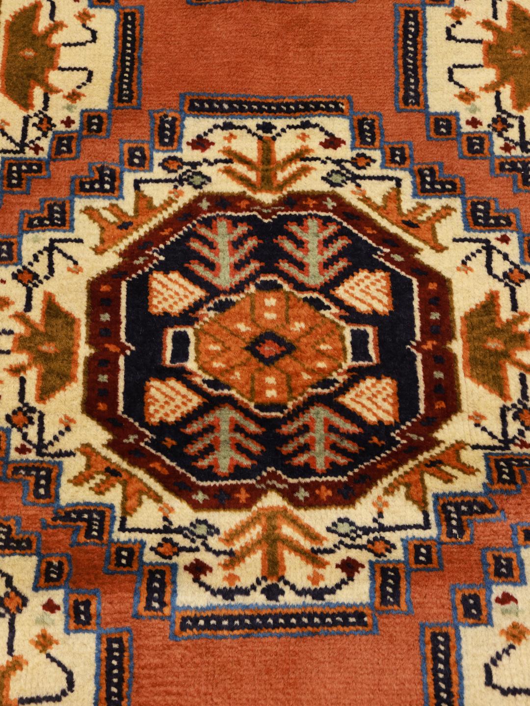 Hand-knotted Middle Eastern Turkaman rug in brown with geometric medallions