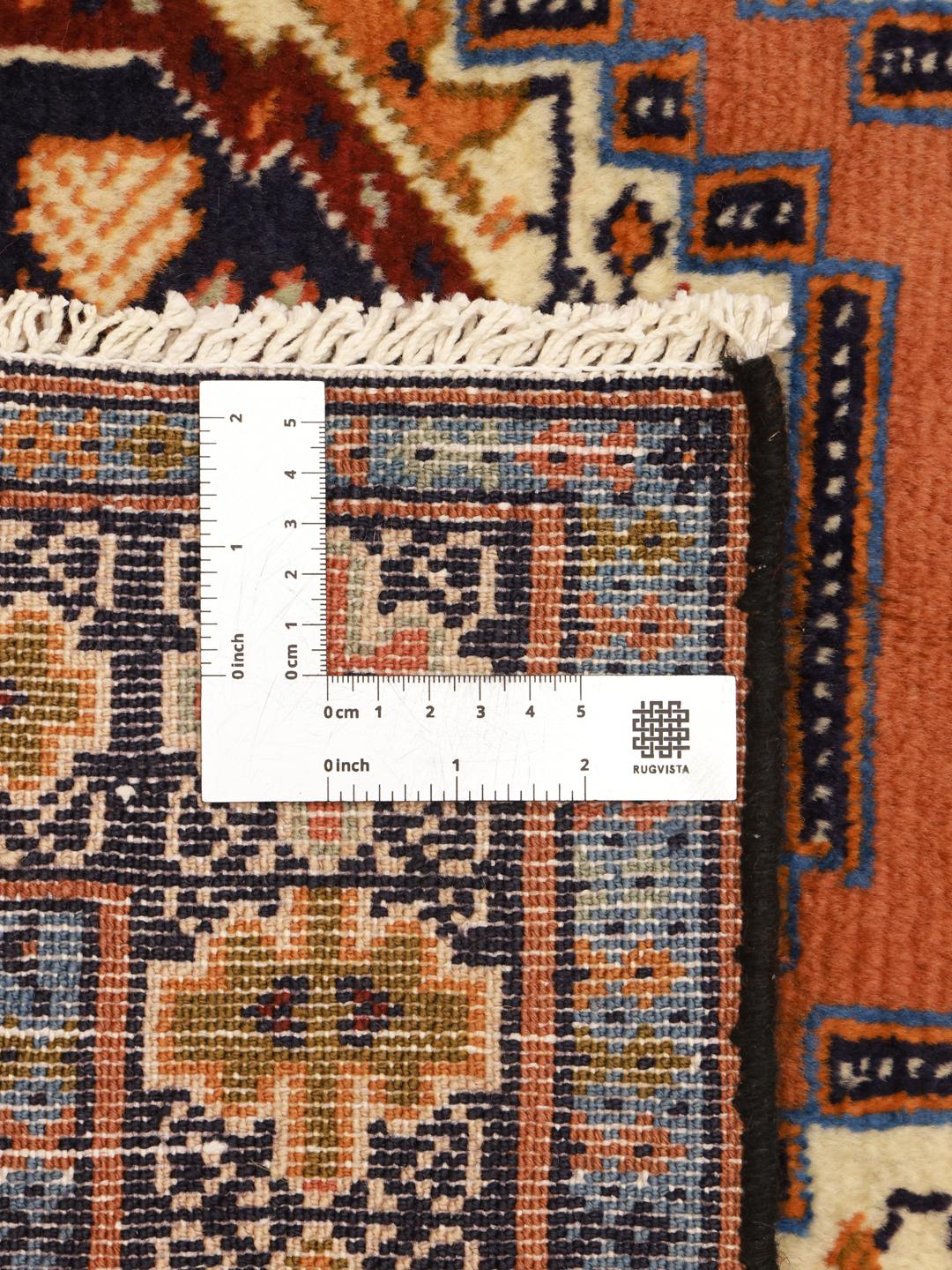 Hand-knotted Middle Eastern Turkaman rug in brown with geometric medallions