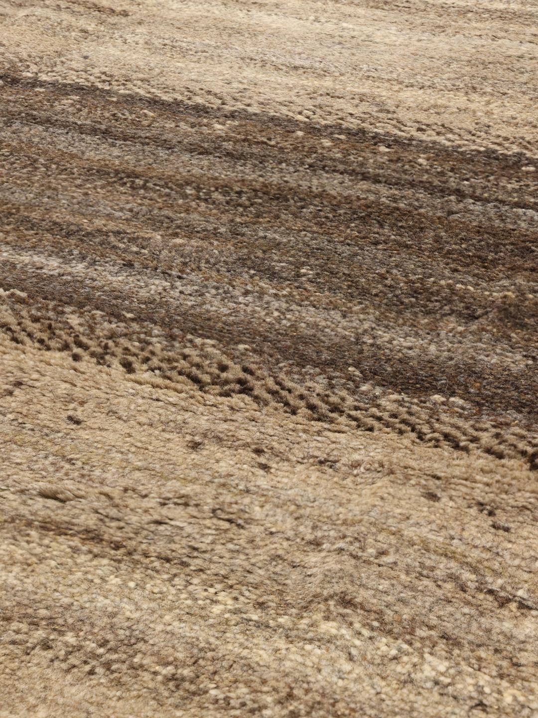 Hand-knotted Gabbeh rug with earthy brown and beige striped pattern from the Middle East.