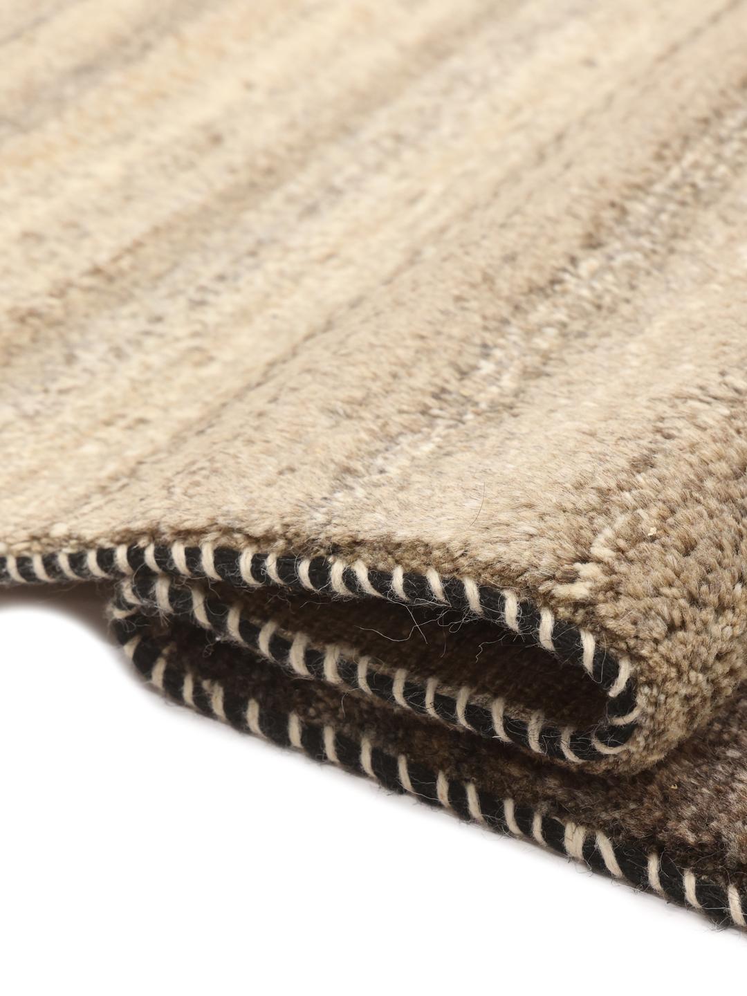 Hand-knotted Gabbeh rug with earthy brown and beige striped pattern from the Middle East.