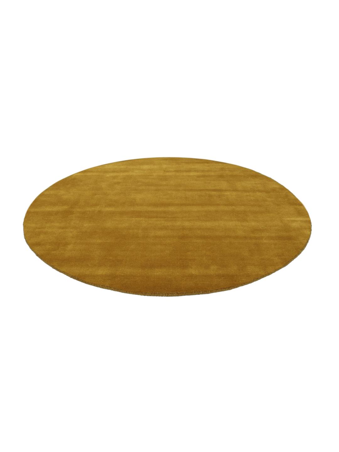 Rond goudkleurig vloerkleed met een zacht fluweelachtig oppervlak