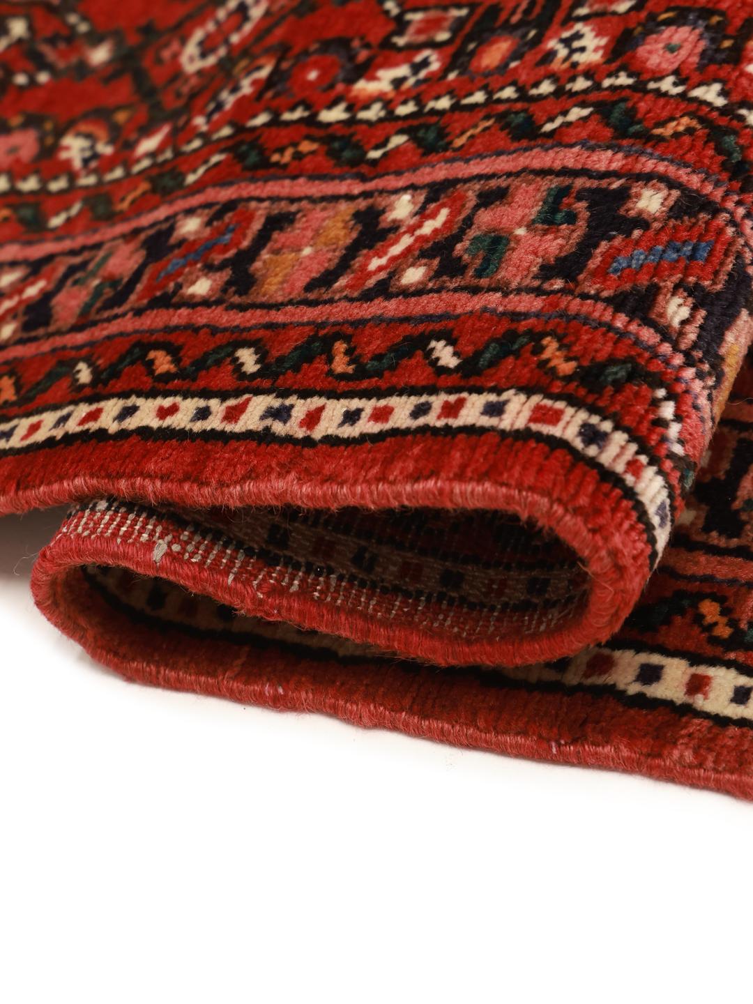 Hand-knotted Hosseinabad runner from the Middle East in deep red tones