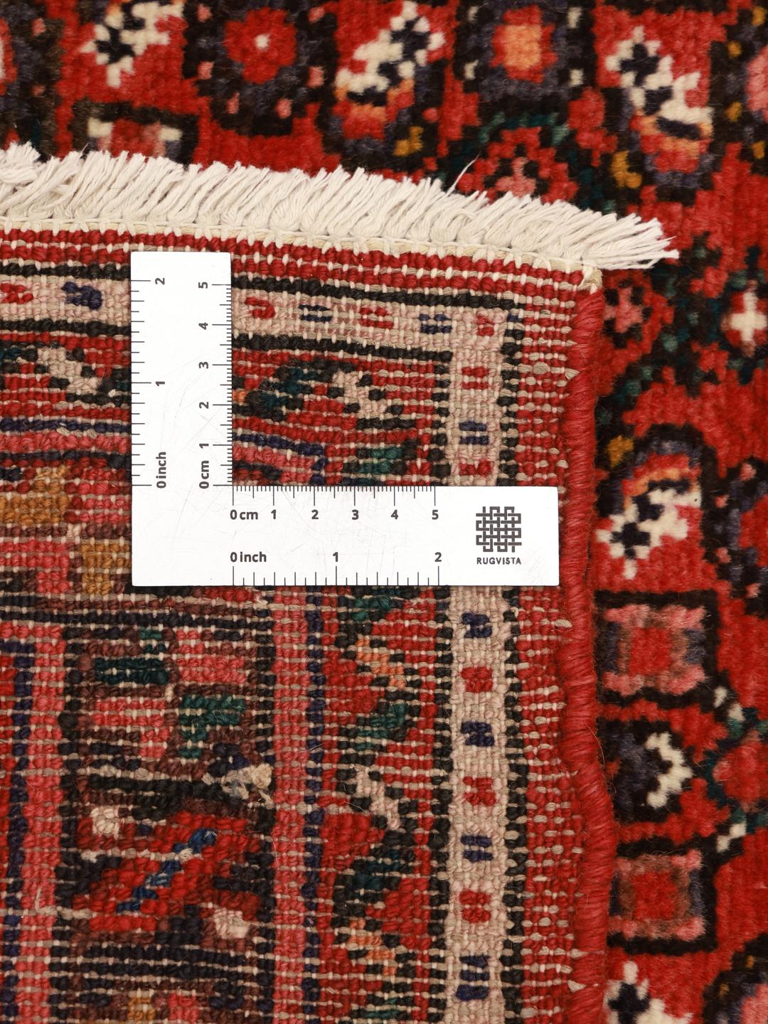 Hand-knotted Hosseinabad runner from the Middle East in deep red tones