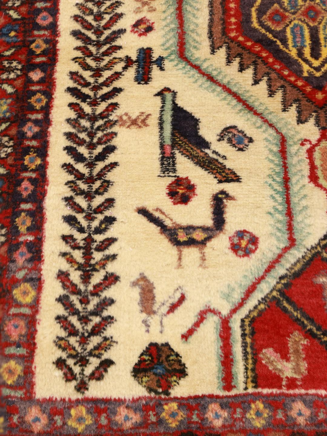 Hand-knotted Afshar Shahre Babak rug with red and beige tribal patterns from the Middle East