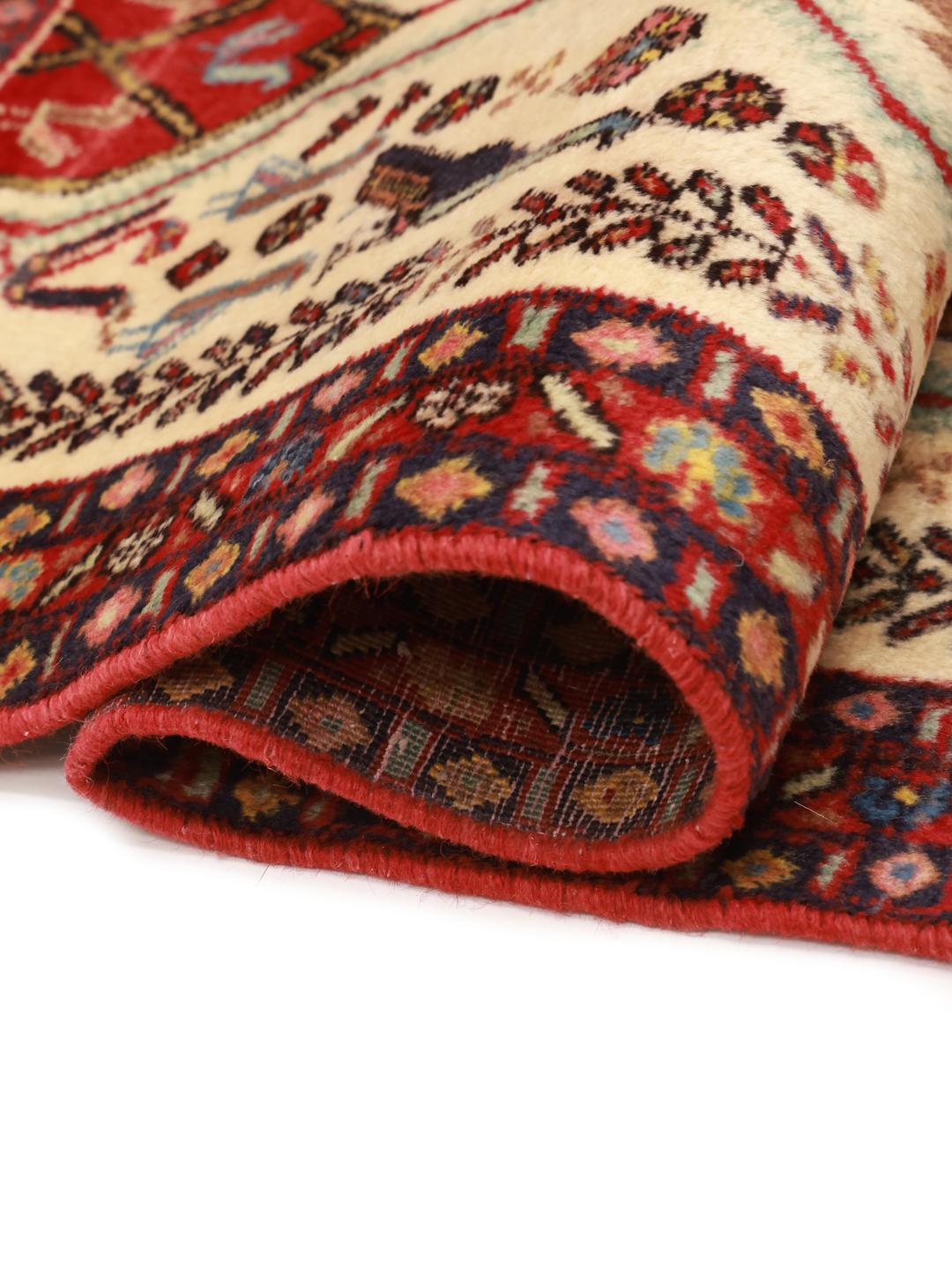 Hand-knotted Afshar Shahre Babak rug with red and beige tribal patterns from the Middle East
