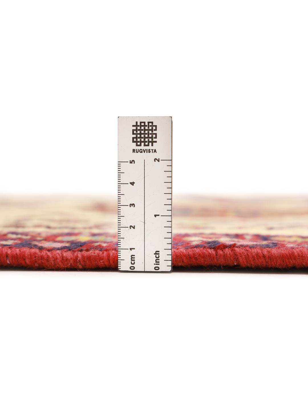 Hand-knotted Afshar Shahre Babak rug with red and beige tribal patterns from the Middle East