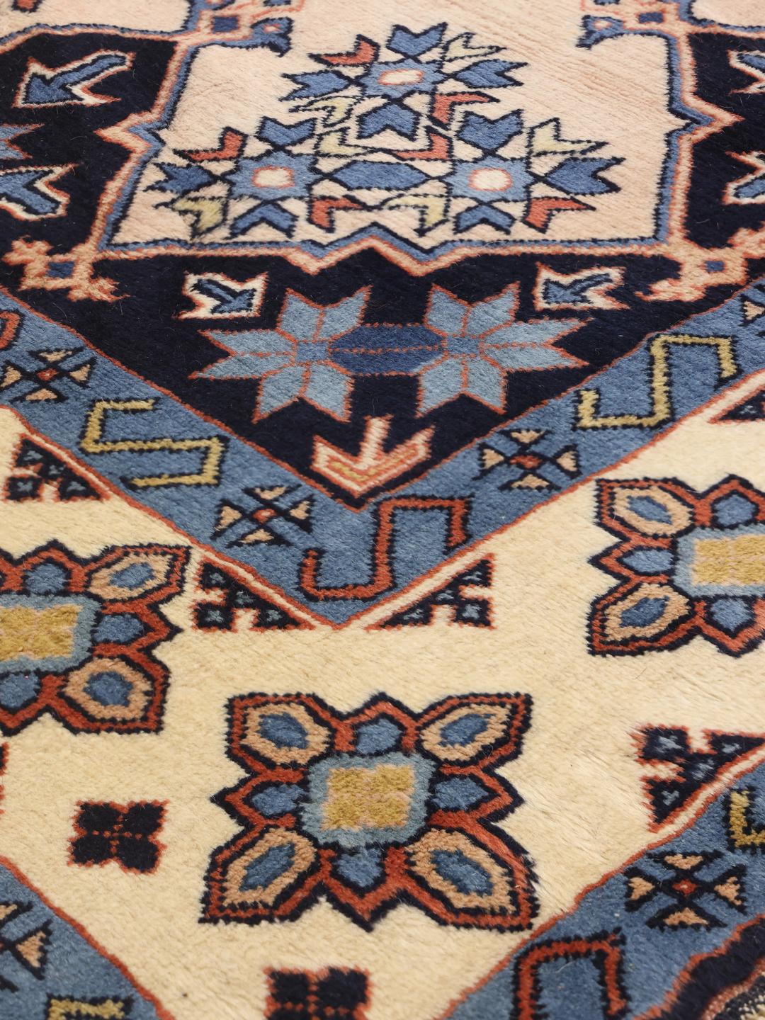 Hand-knotted Heriz rug from the Middle East in multicolor geometric design
