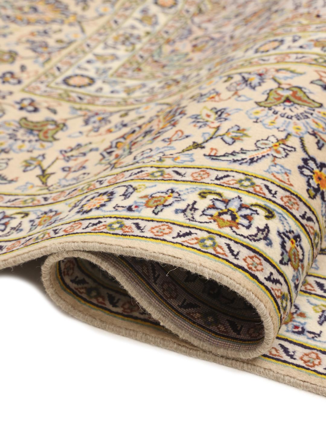 Hand-knotted Keshan rug from the Middle East featuring a floral medallion on a beige field
