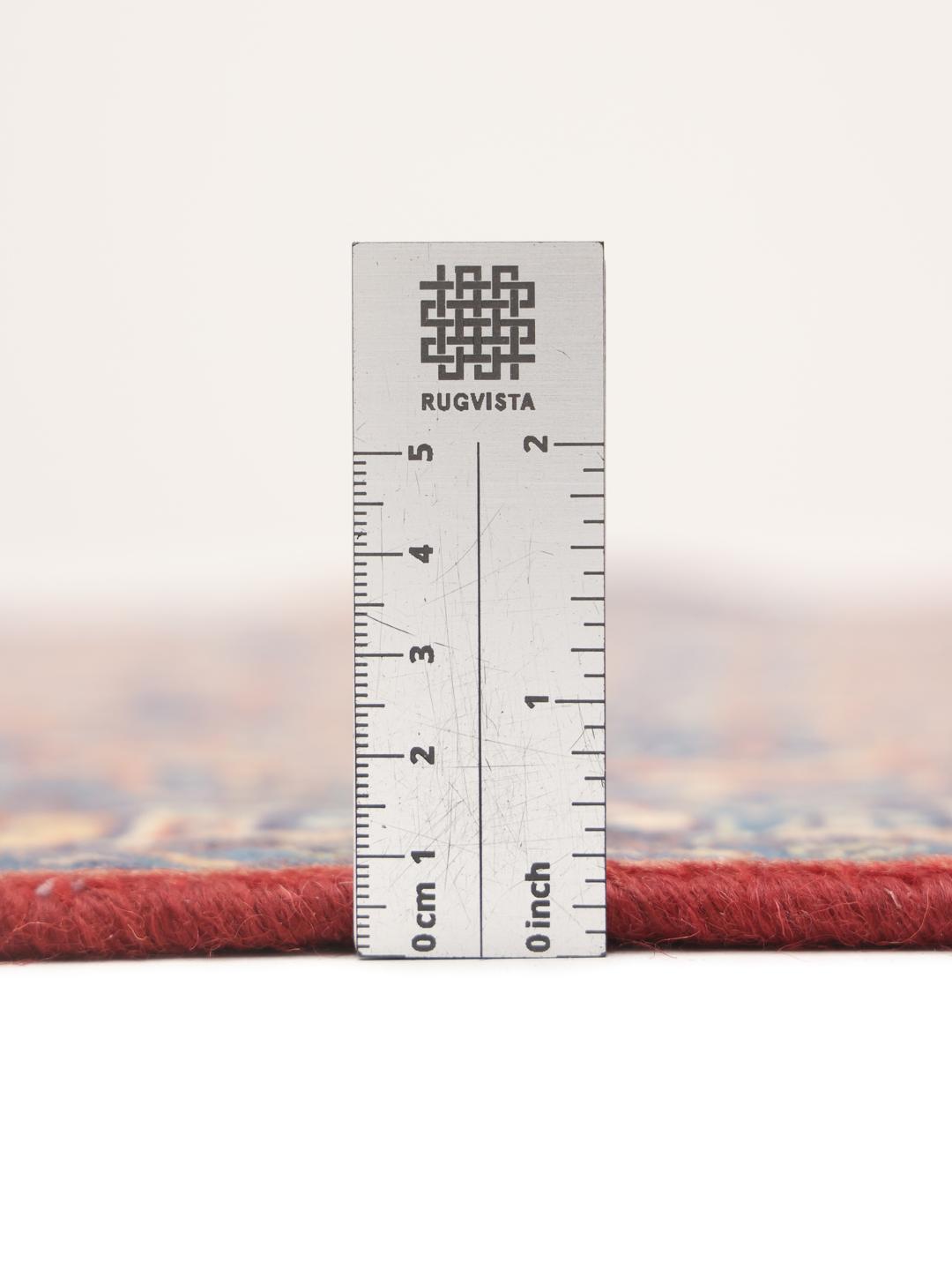 A hand-knotted Hamadan rug from the Middle East featuring blue and red tones.