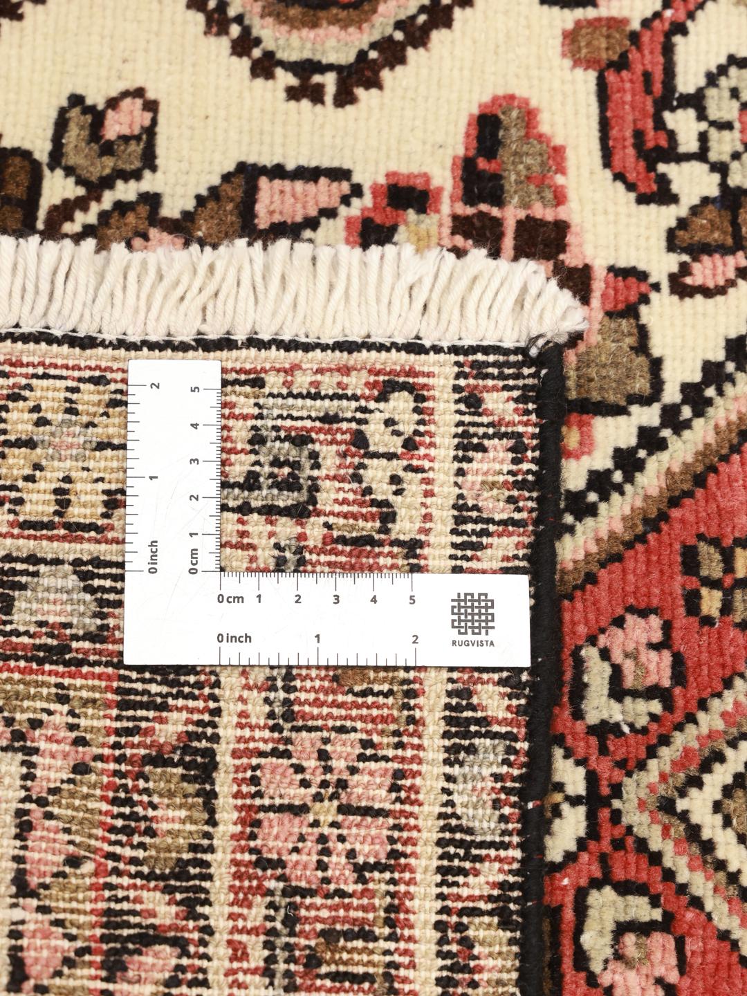 Hand-knotted Middle Eastern Hamadan rug with a red and beige floral medallion