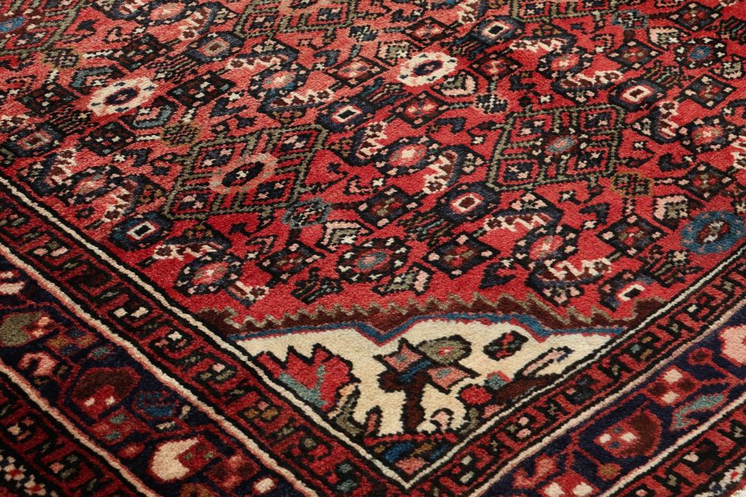 Handmade Hosseinabad runner from the Middle East with a vibrant red Wool pile