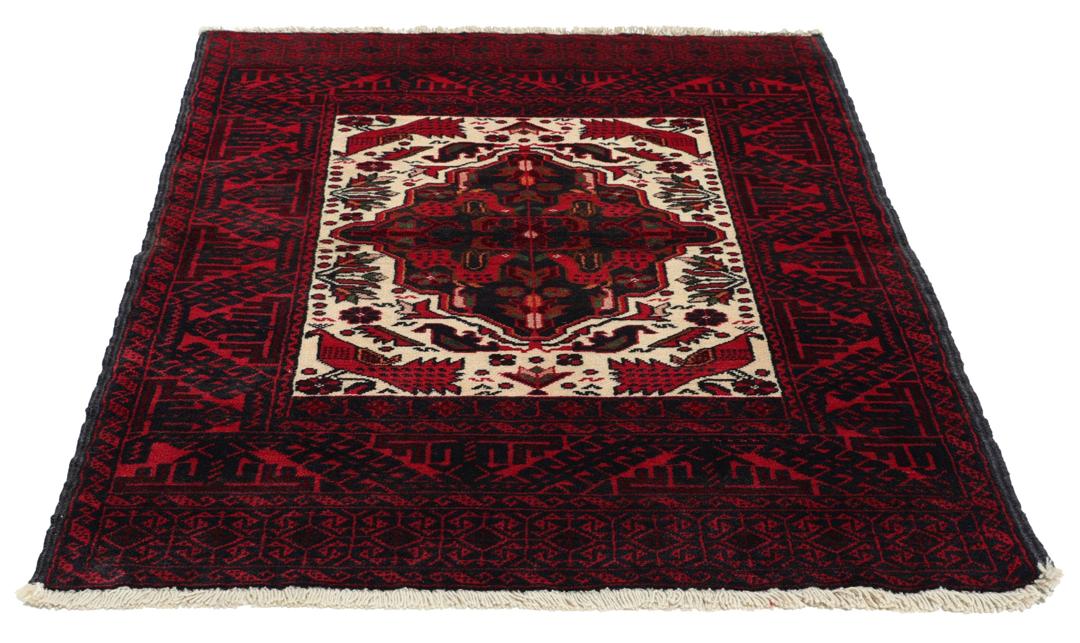 Handgeknoopt Beluch-tapijt in rood en blauw met traditionele tribale patronen