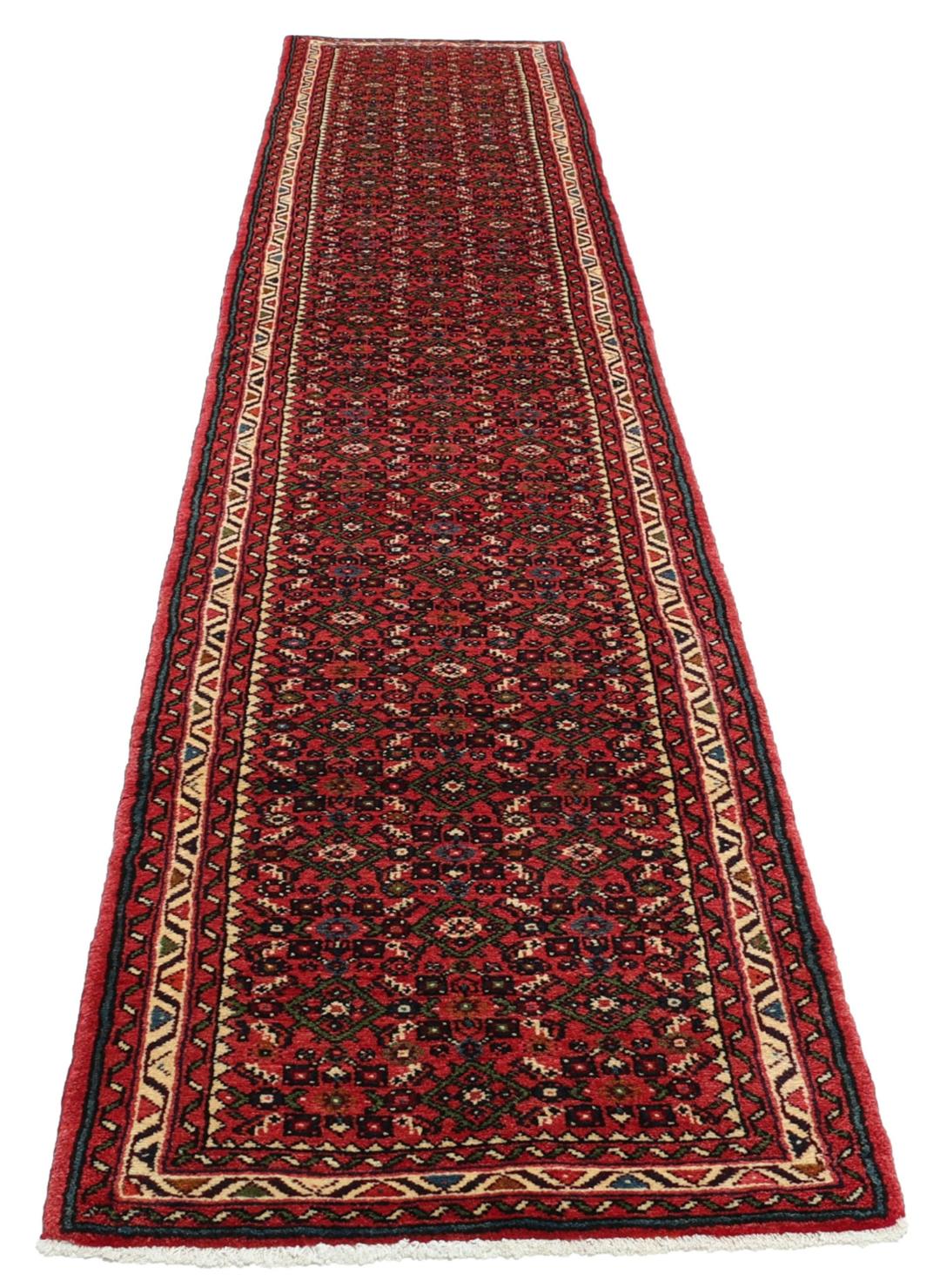 Hand-knotted Hosseinabad runner from the Middle East in shades of red