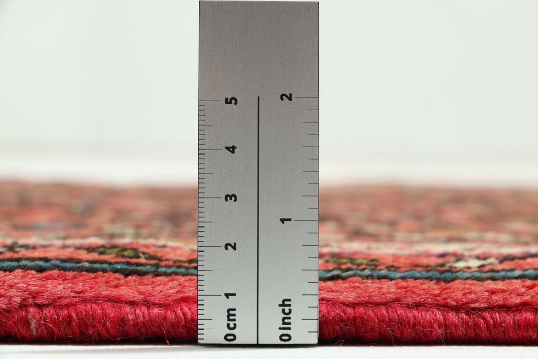 Hand-knotted Hosseinabad runner from the Middle East in shades of red