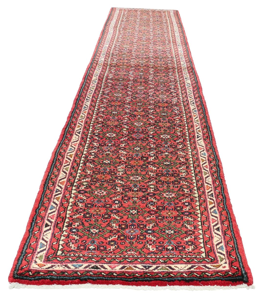 Hand-knotted Hosseinabad runner from the Middle East in shades of red