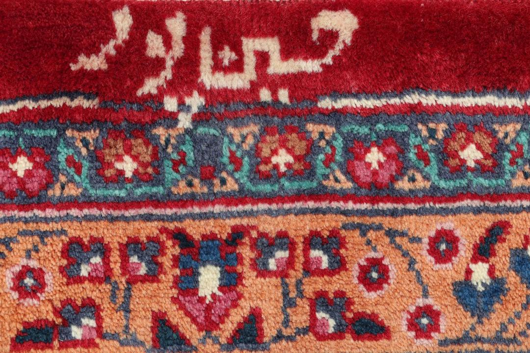 Tapis Mashad noué à la main provenant du Moyen-Orient dans des tons rouge profond et bleu