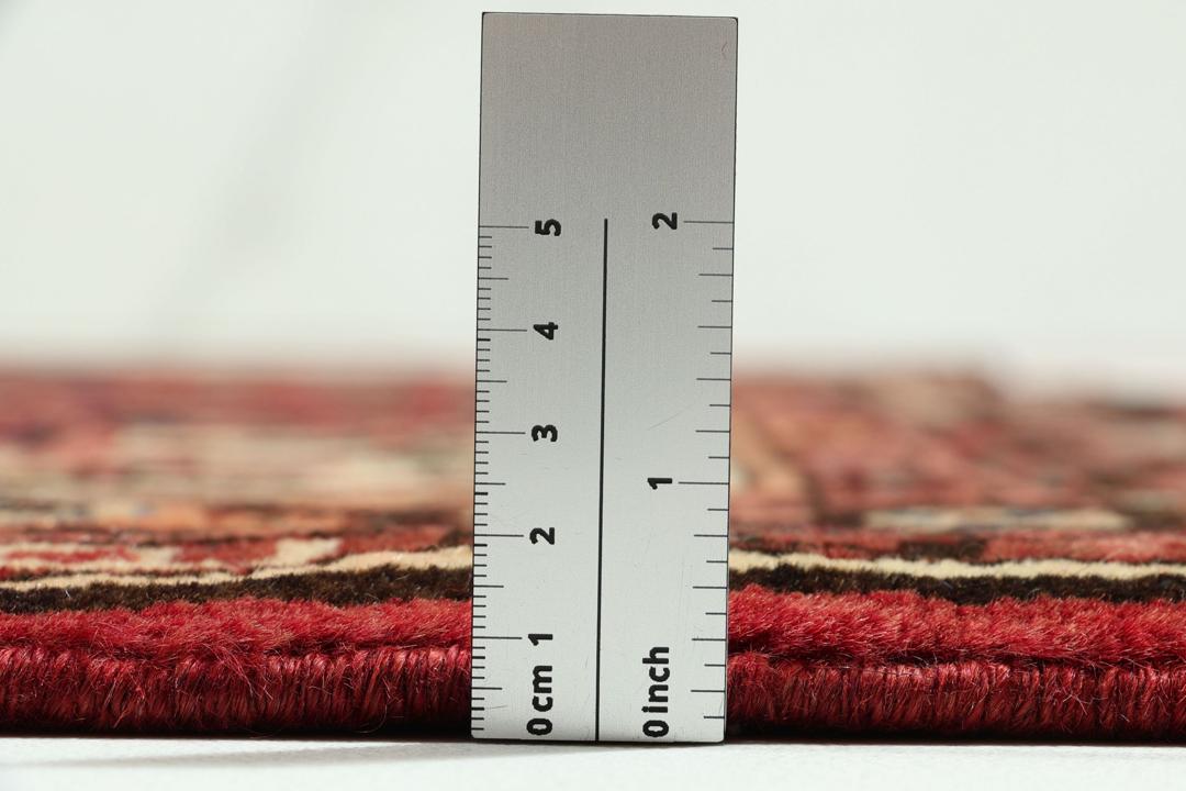 Håndknyttet Hosseinabad-tæppe fra Mellemøsten i nuancer af rødt
