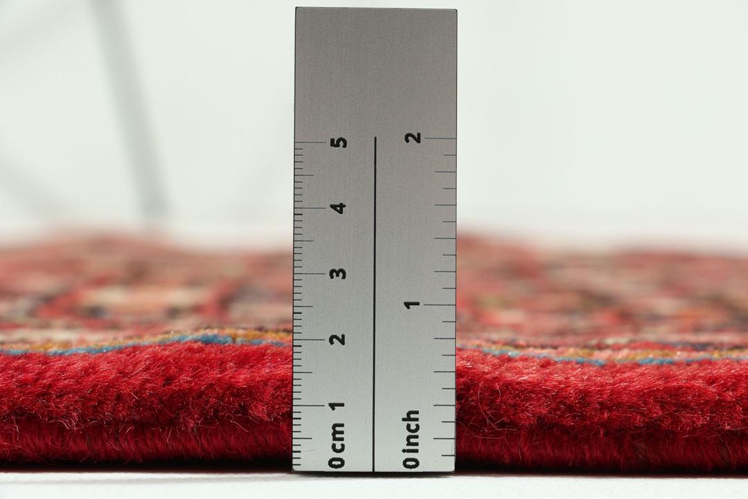 Handmade Hosseinabad runner from the Middle East featuring a vibrant red field