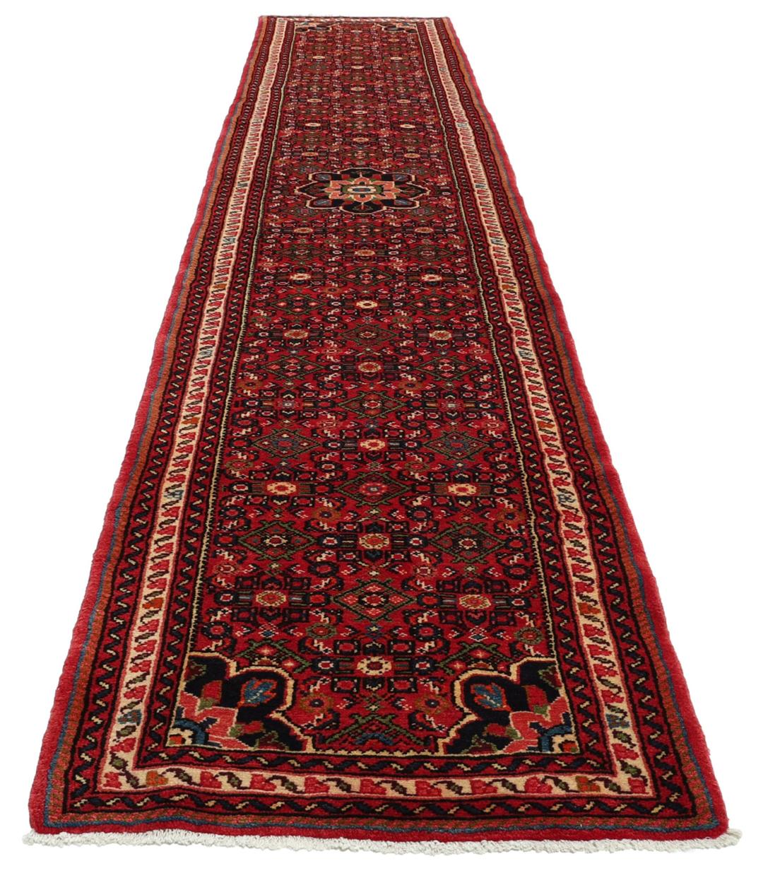 Handmade Hosseinabad runner from the Middle East featuring a vibrant red field