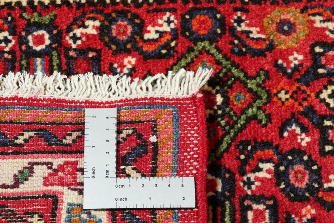 Handmade Hosseinabad runner from the Middle East featuring a vibrant red field