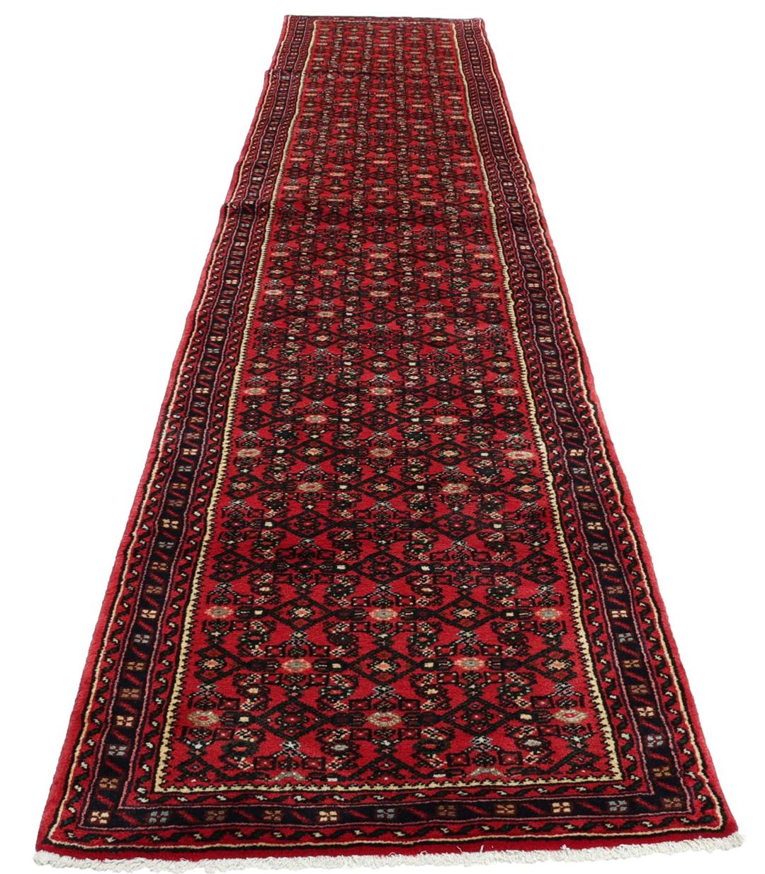 Hand-knotted Hosseinabad runner with a geometric pattern in red and dark blue