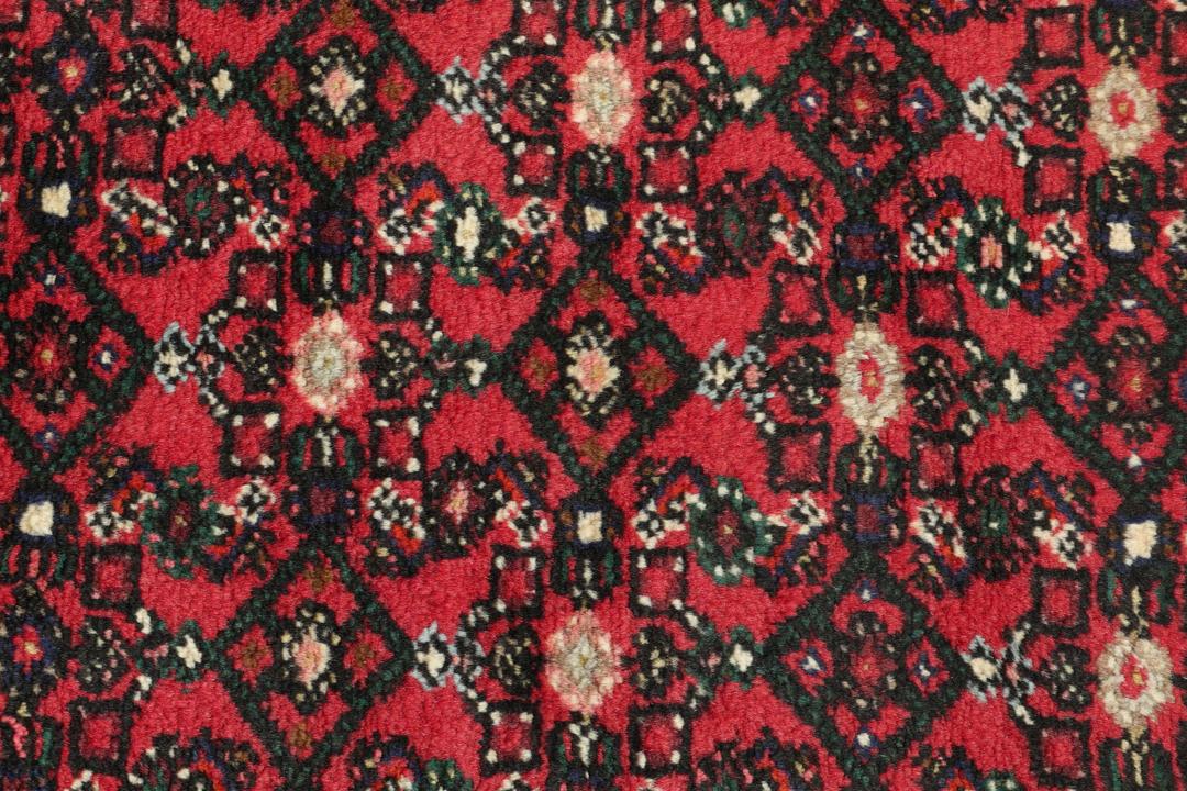 Hand-knotted Hosseinabad runner with a geometric pattern in red and dark blue