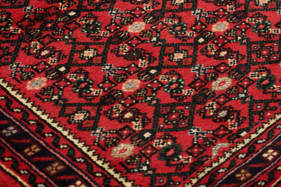 Hand-knotted Hosseinabad runner with a geometric pattern in red and dark blue