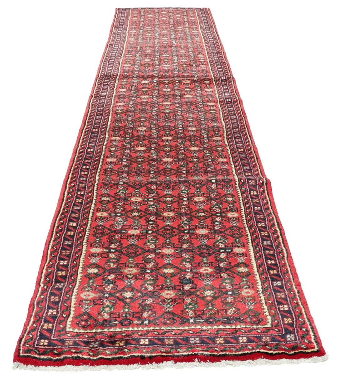 Hand-knotted Hosseinabad runner with a geometric pattern in red and dark blue