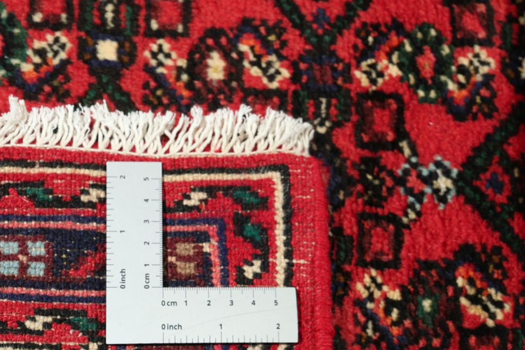 Hand-knotted Hosseinabad runner with a geometric pattern in red and dark blue