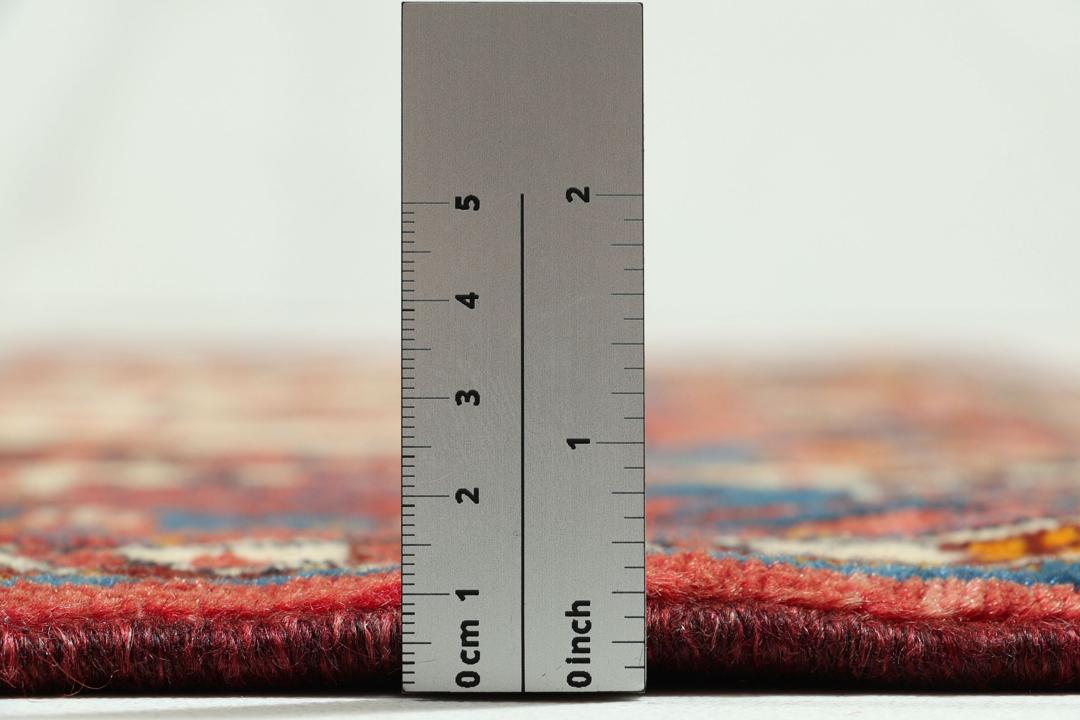 Hand-knotted Hamadan rug from the Middle East featuring a vibrant red and blue colour palette
