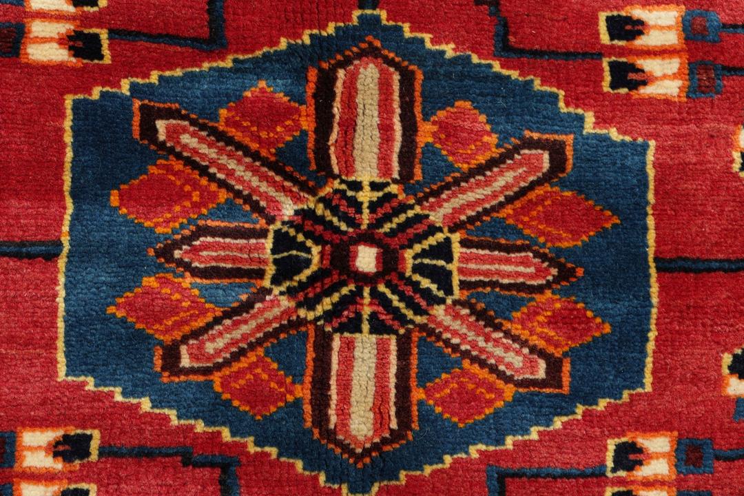 Hand-knotted Hamadan rug from the Middle East featuring a vibrant red and blue colour palette