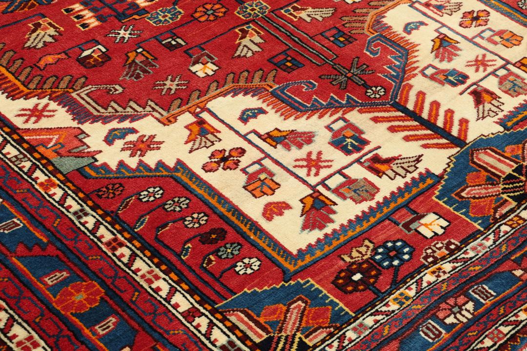 Hand-knotted Hamadan rug from the Middle East featuring a vibrant red and blue colour palette